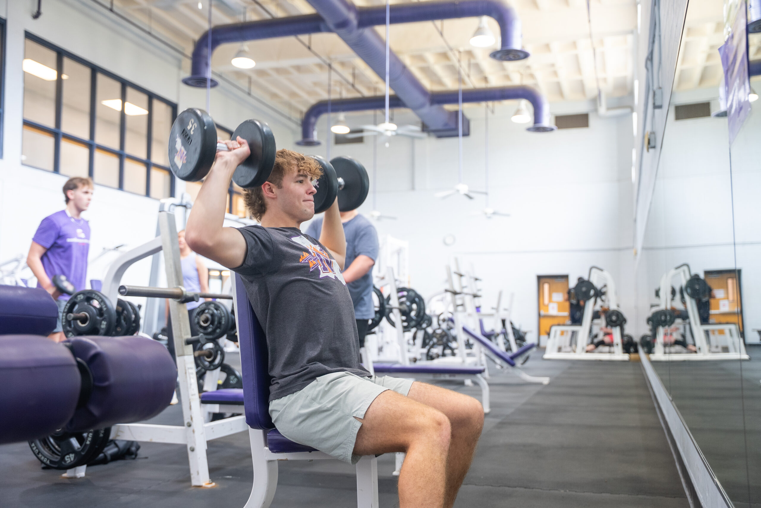 NSU student lifting weights