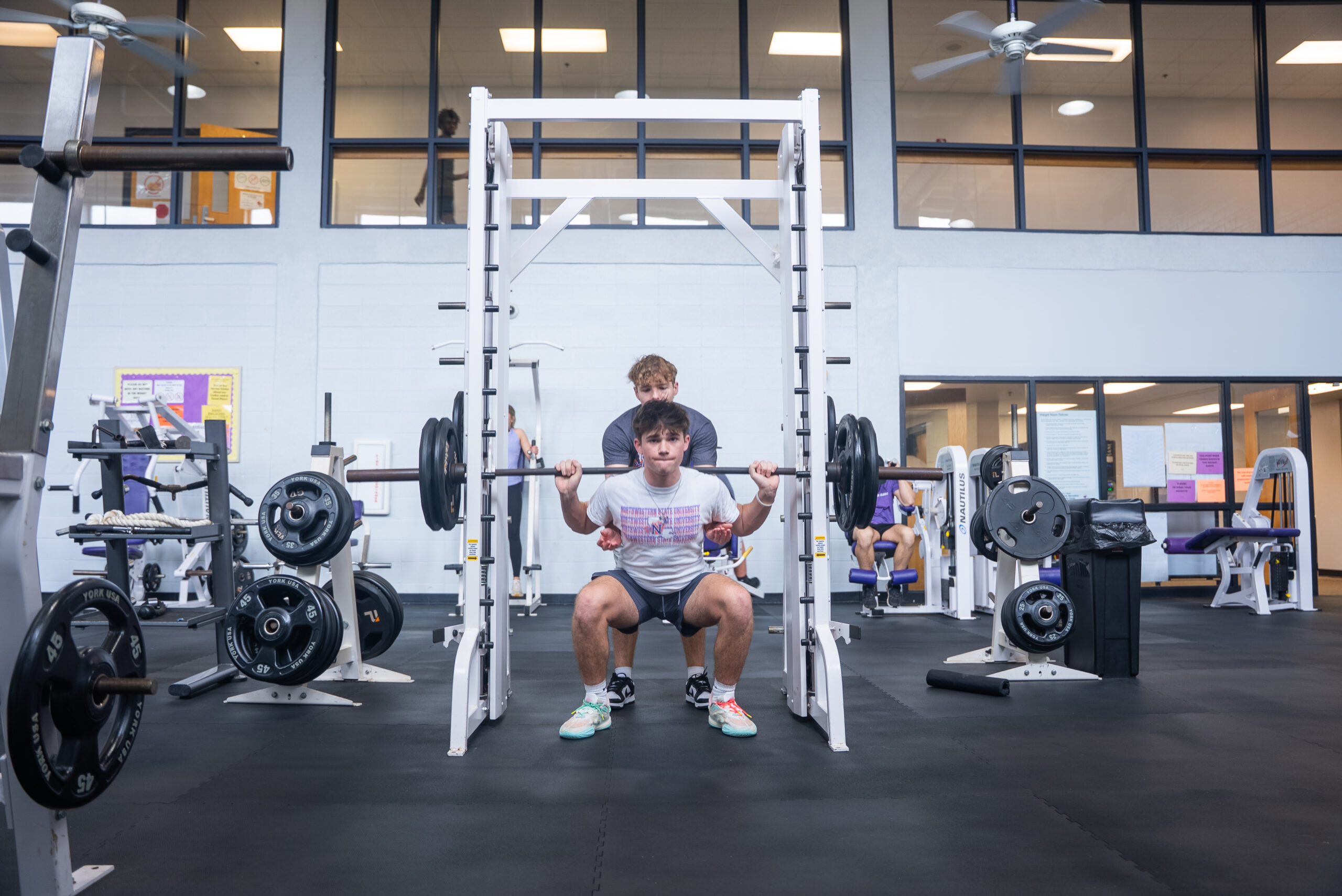 NSU student doing squats at the WRAC