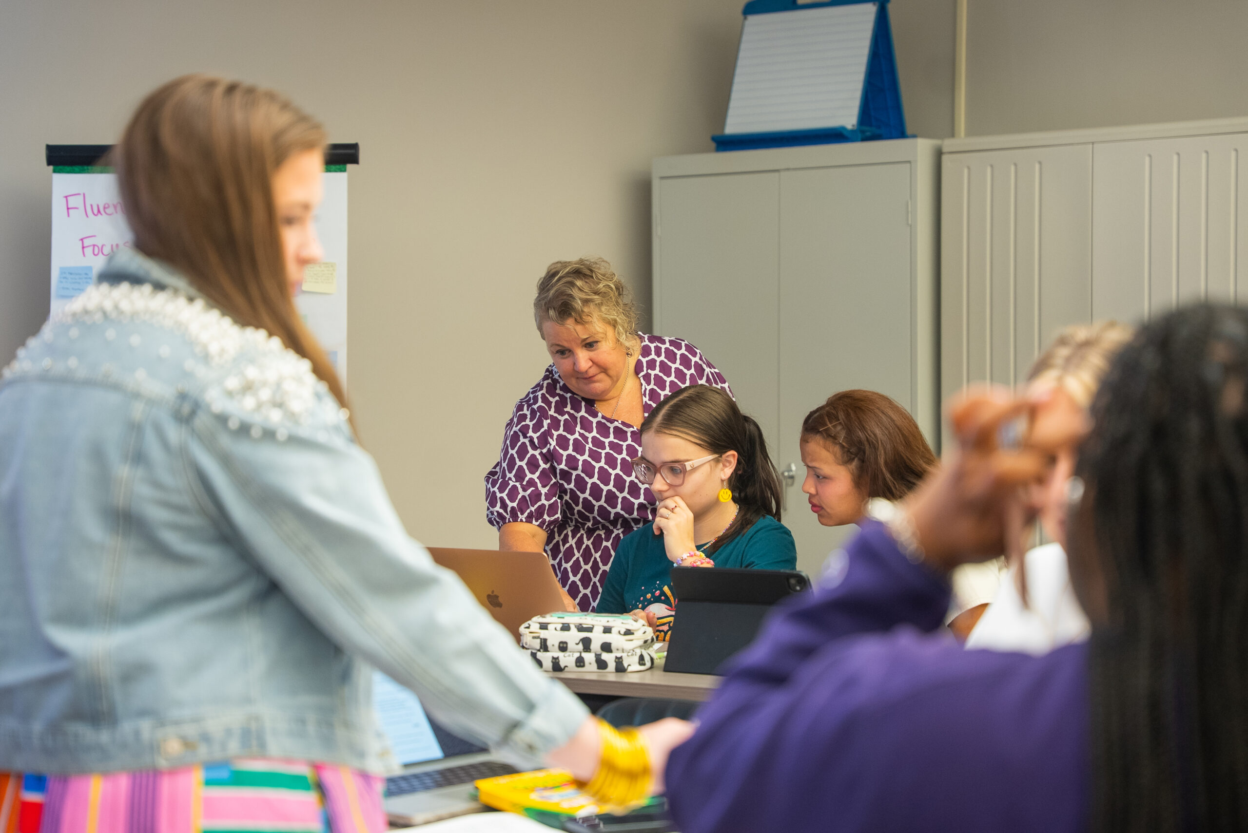 faculty member looking at a student's computer