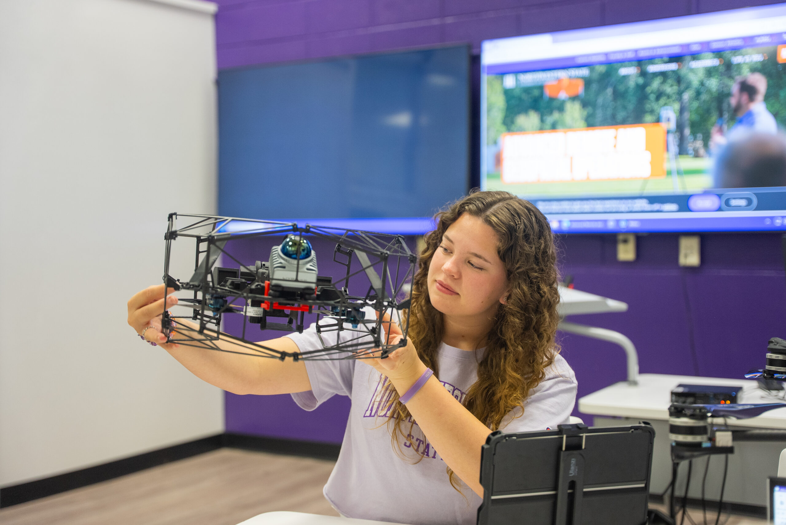 student holding drones