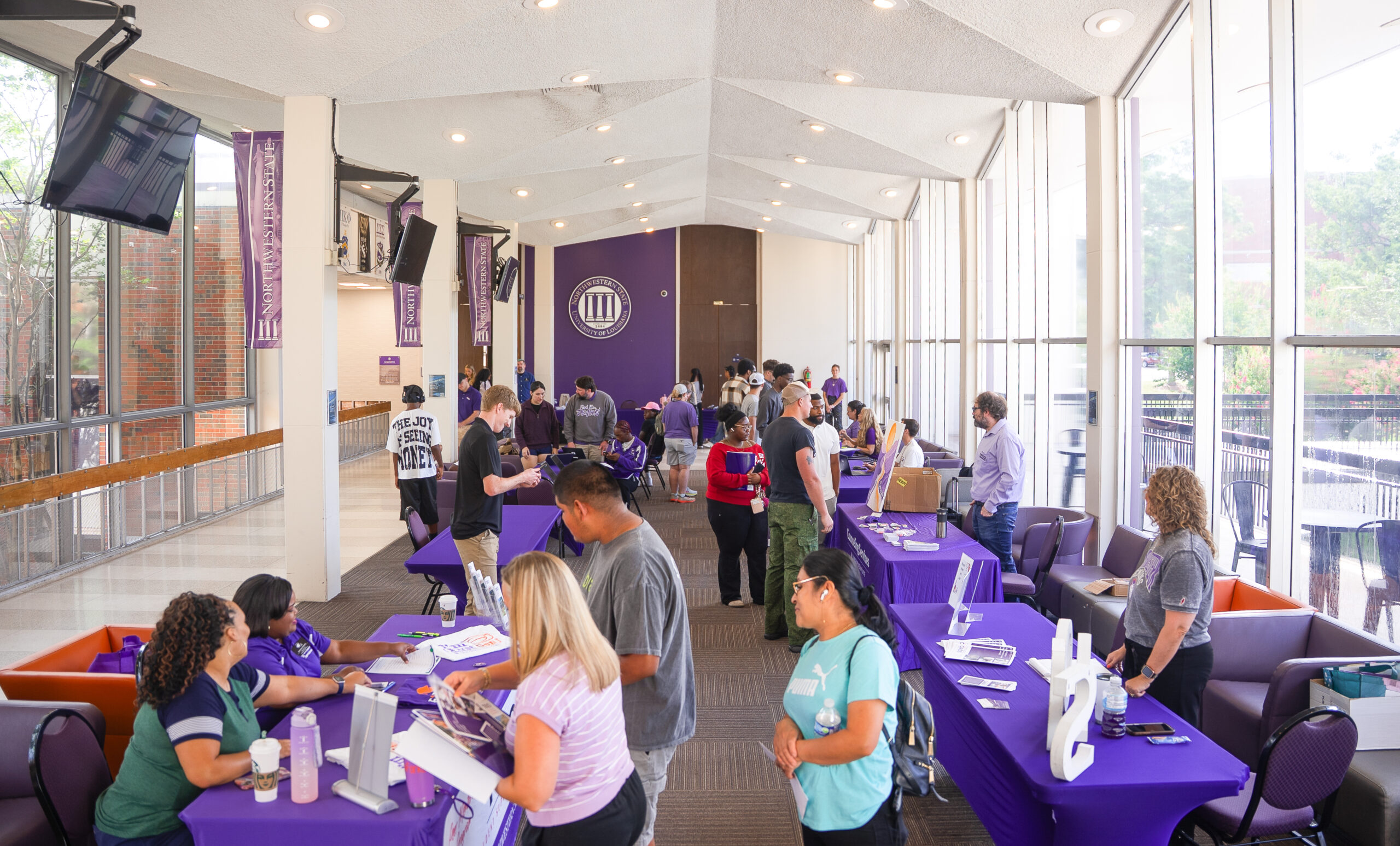 Students and their families visit with university representatives during Northwestern State University's Registration Rally in the Friedman Student Union.