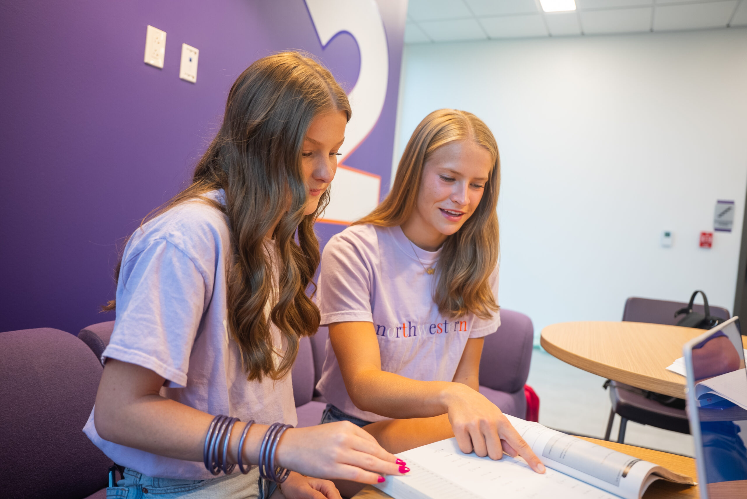 two girls studying on campus together