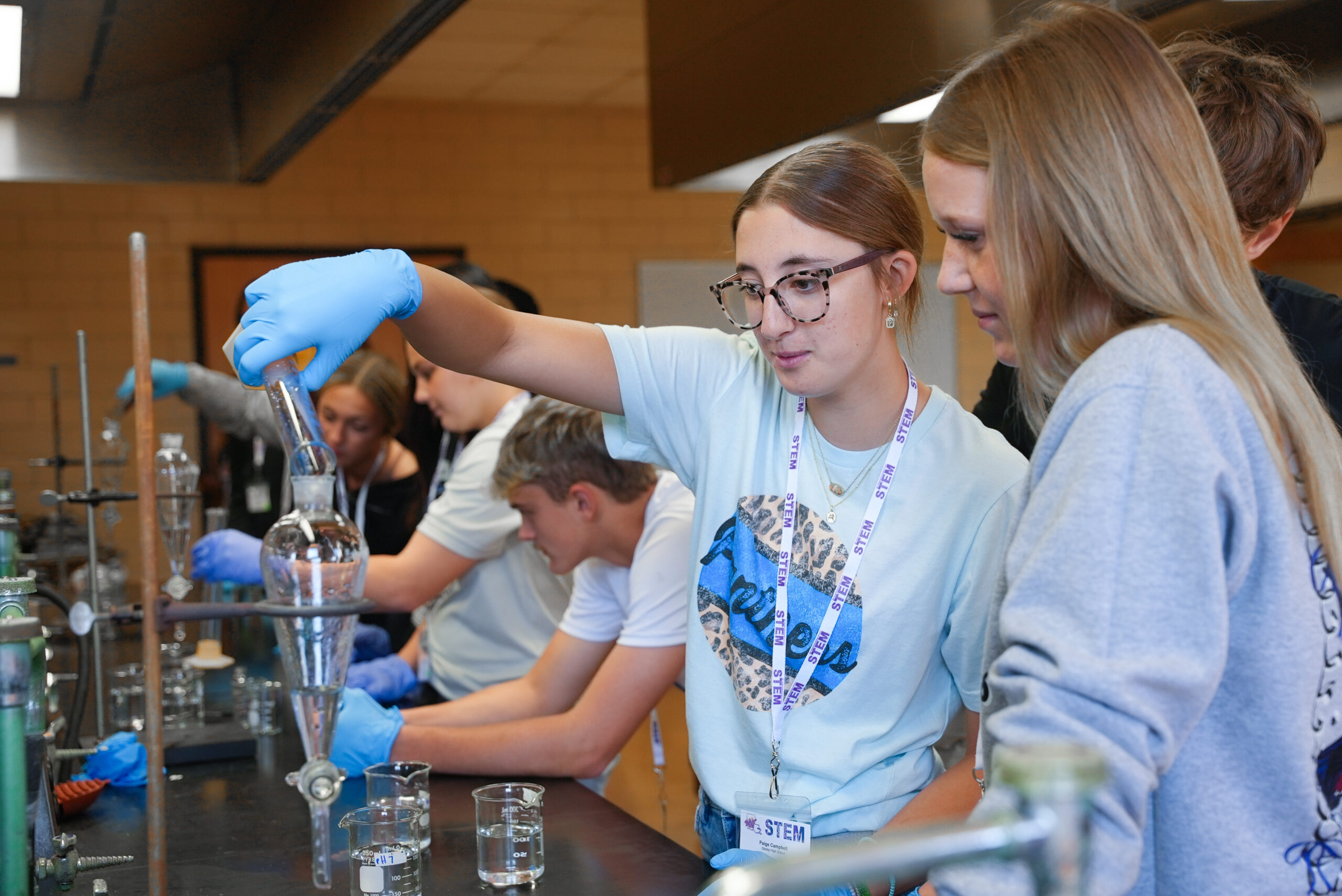 Stanley High School students Paige Campbell, left, and Karsyn Weeks participate in a science experiment during NSU’s STEM Day Sept. 25.