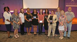 Honorees from the Department of Social Work were, from left, Dr. MaryAnne Candley, Dustina Guillot, Amanda Spraggins, Aleeya Jefferson, Marissa Howard, Kaci Green, Kiley Gatson, Lisa Mount, Greere Koehler, Dr. Susan Campbell and Randy Hoffpauir. 