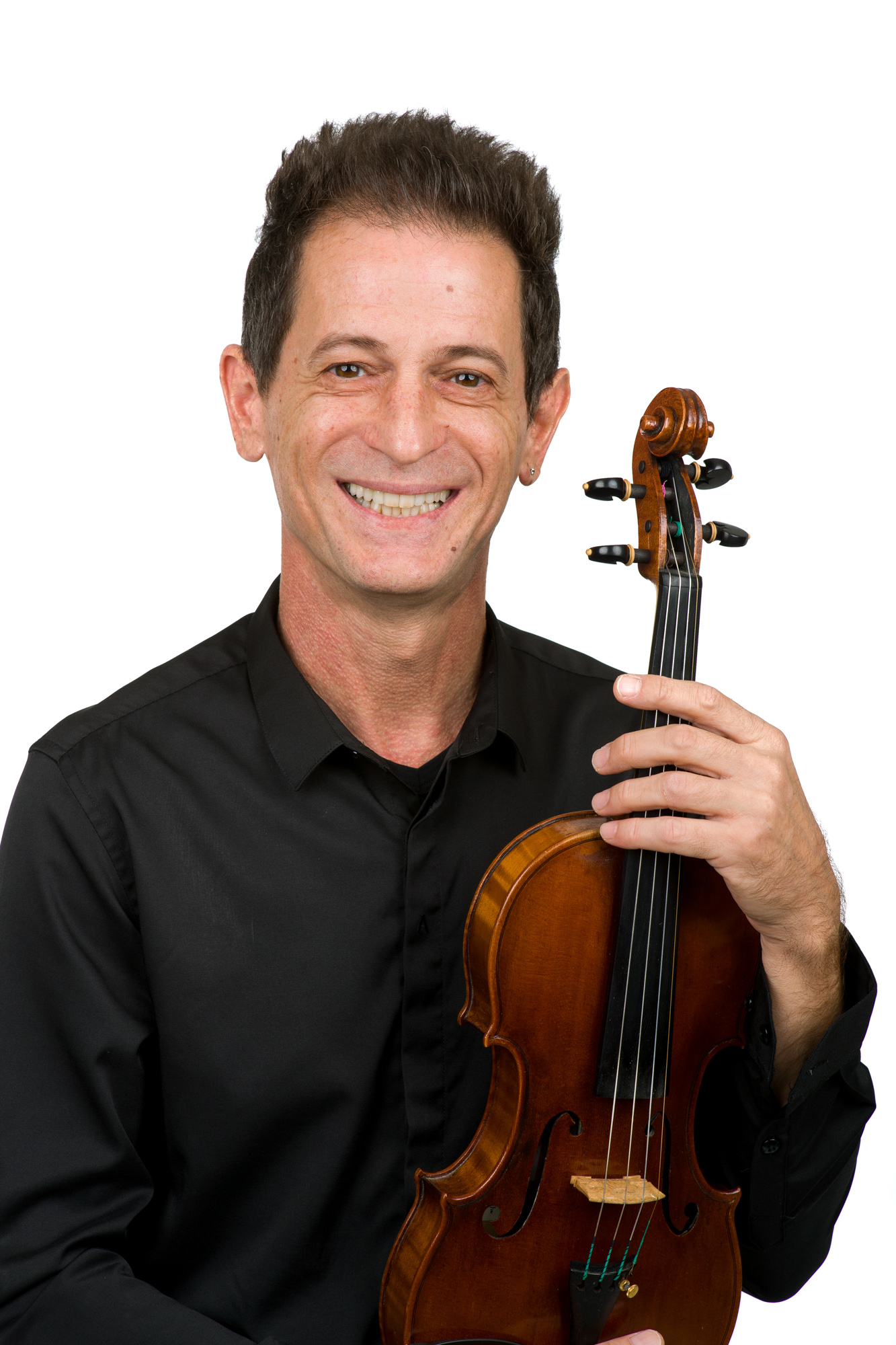 Andrej Kurti holding an instrument in a headshot