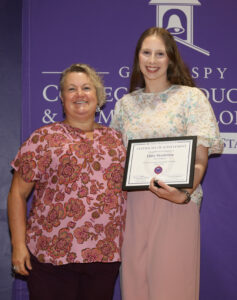 Early Childhood graduate Haley Henderson of Bossier City was congratulated by Dr. Jessica Church. 