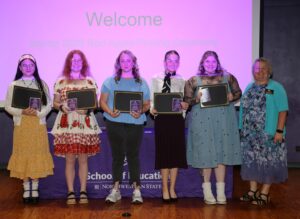 NSU Early Childhood Education majors recognized with Apple pins were, from left, Jozey Isom, Alexa Green, Taylor Poole, Isabella Sylvia, Serenity White and Dr. Jessica Church. 