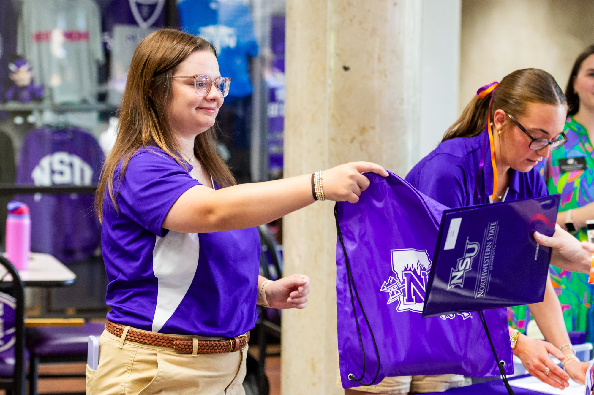 Elizabeth (Ellie) Hardy greets incoming students during check-in at Freshman Connection on NSU's Shreveport campus.