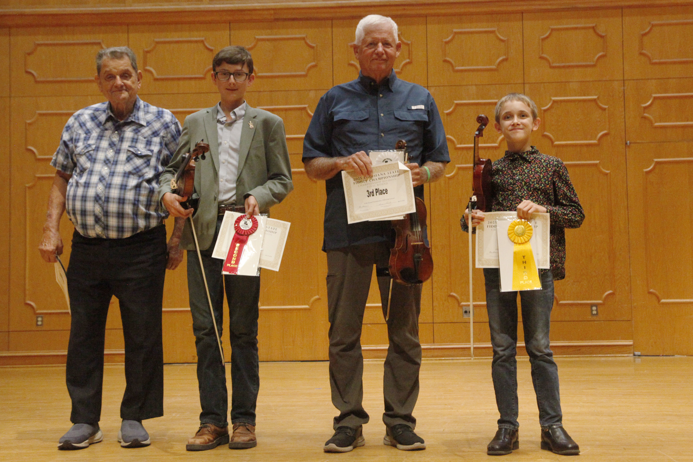 The annual Louisiana State Fiddle Championship was held in Magale Recital Hall on the campus at Northwestern State University as part of the 45th Annual Natchitoches-NSU Folk Festival. The winners were, left to right, 2025 Louisiana State Fiddle Champion Ron Yule of DeRidder, second place Samuel O'Kelley of DeRidder, third place Phillip Mayo of Leesville and fourth place Asher Hotard of Folsom. Photo by Peter Jones.