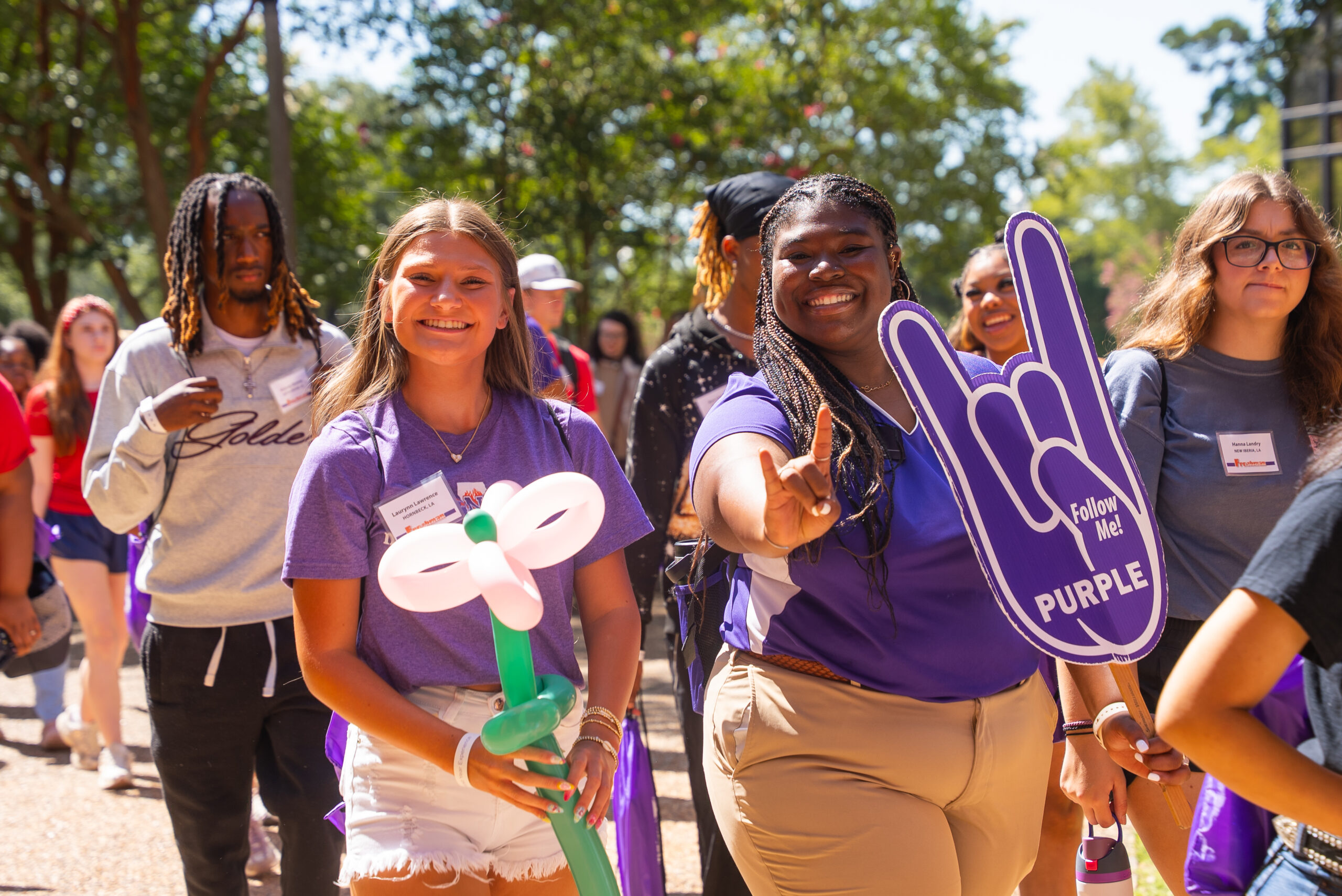 Freshman Connector Camilia Adger, center right, walks with incoming student Laurynn Lawrence during Freshman Connection at Northwestern State University.