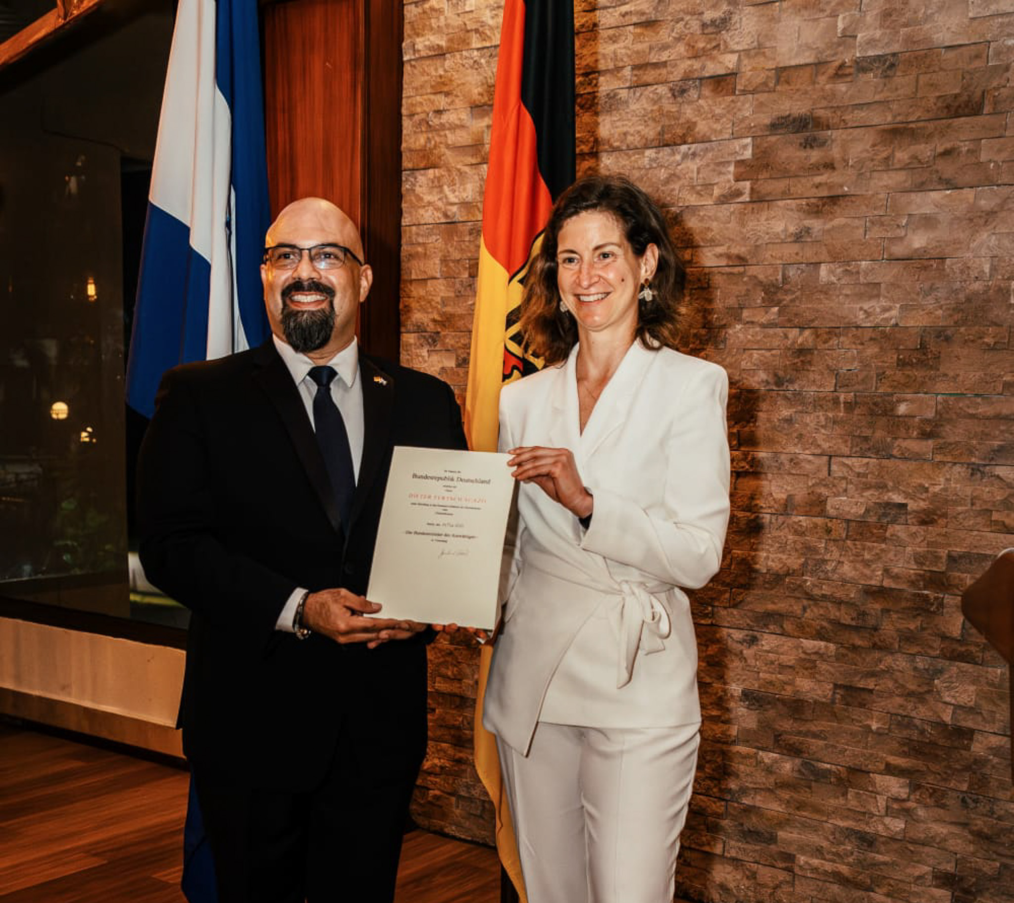 Northwestern State University alumnus Dieter Fertsch receives his exequatur from German Ambassador Daniel Vogl following his appointment as honorary consul of the Federal Republic of Germany in Honduras.