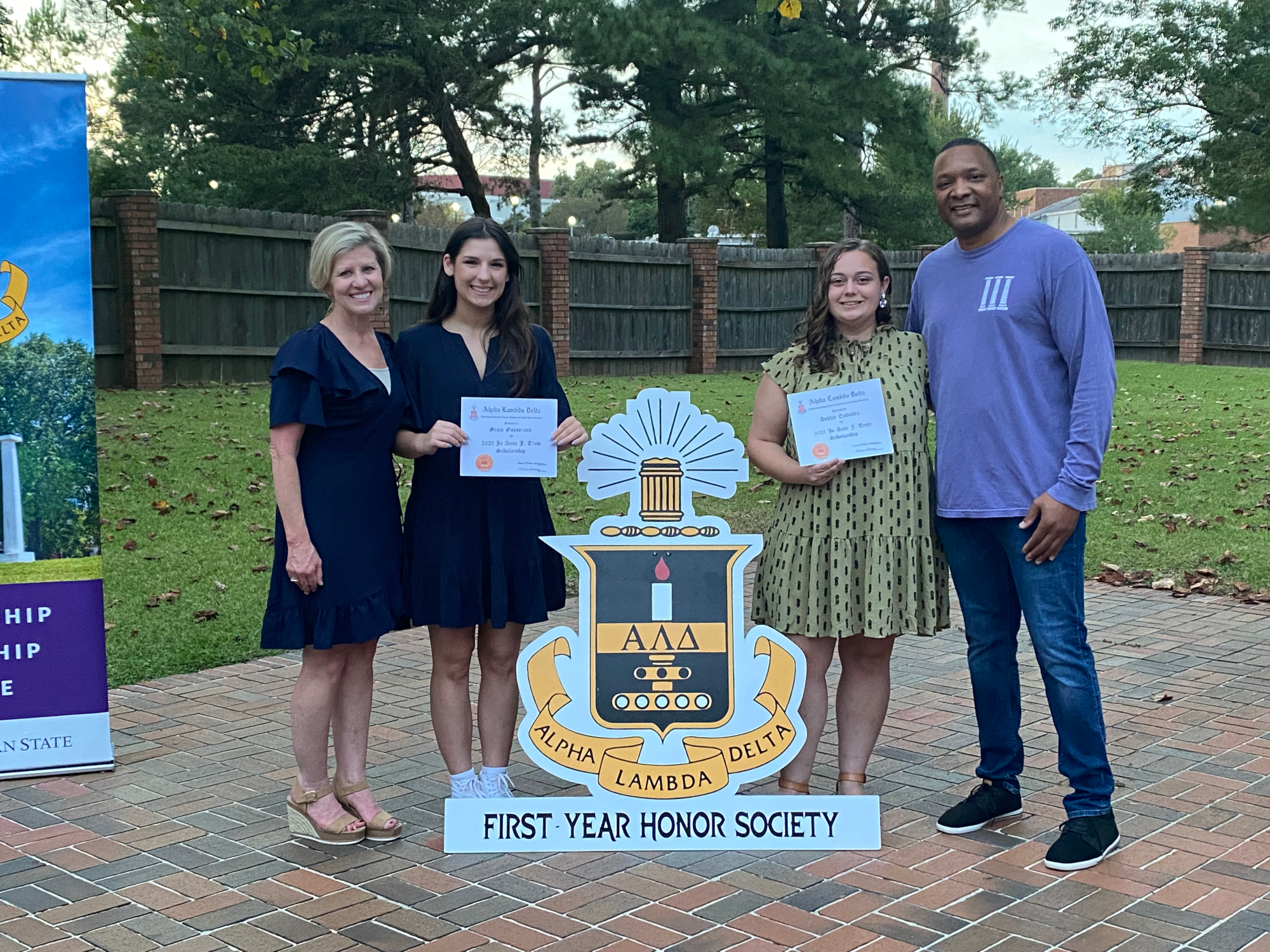 Grace Gosserand and Ashely Eubanks receive the Jo Anne Trow scholarship with Reatha Cox and Marcus Jones