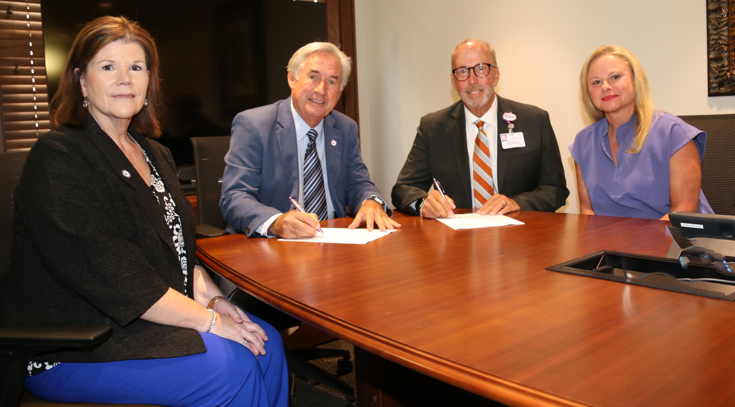 An agreement between NSU and Natchitoches Regional Medical Center will allow eligible students to receive care and medication at NRMC’s Walk-In Clinic with no co-pay or deductibles. Administrators say the public/private partnership fills a need for students in need of medical care after hours and on weekends. From left are NSU Executive Director for Economic Development and University Advancement Laurie Morrow, NSU President James Genovese, NRMC CEO Kirk Soileau and NSU Director of Health Services Jessica Nash.