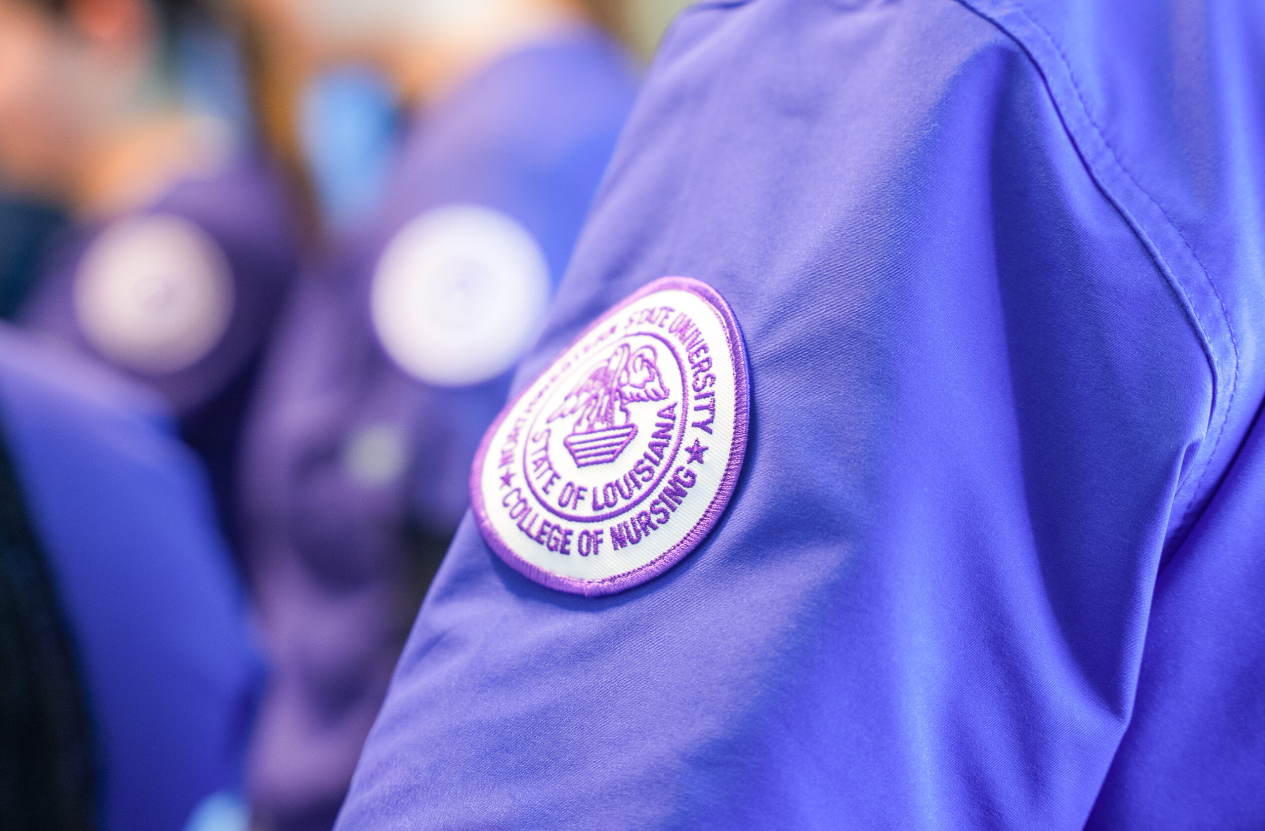 A Northwestern State University College of Nursing patch is displayed on a student’s uniform at the Shreveport campus.