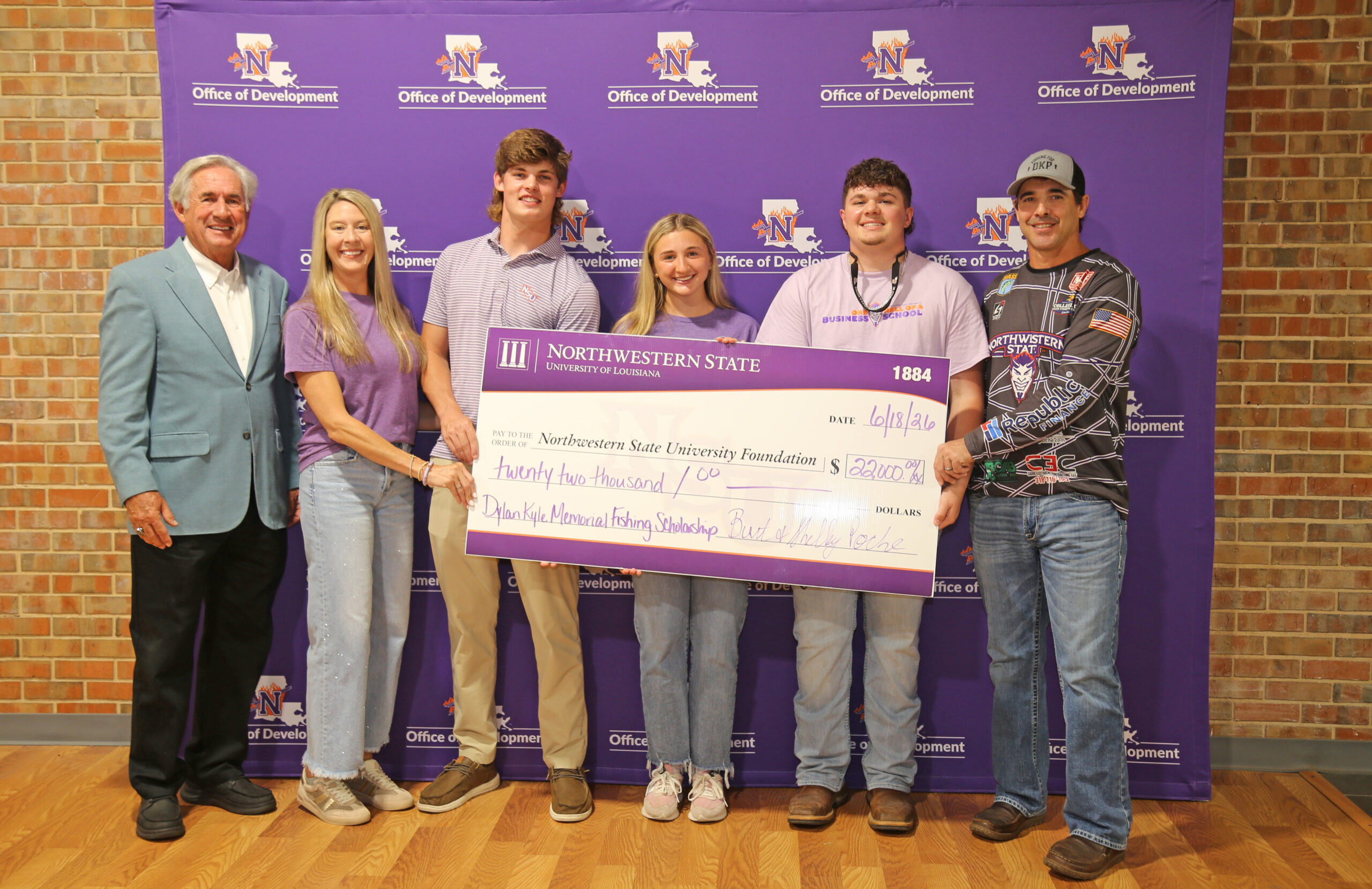 Three incoming Northwestern State University freshmen anglers were awarded Dylan Kyle Poche scholarships to compete with the NSU Fishing Team. From left are NSU President James Genovese, Shelley Poche, Michael Watkins, Adelyn Parr, Eli Lockart and Burt Poche.