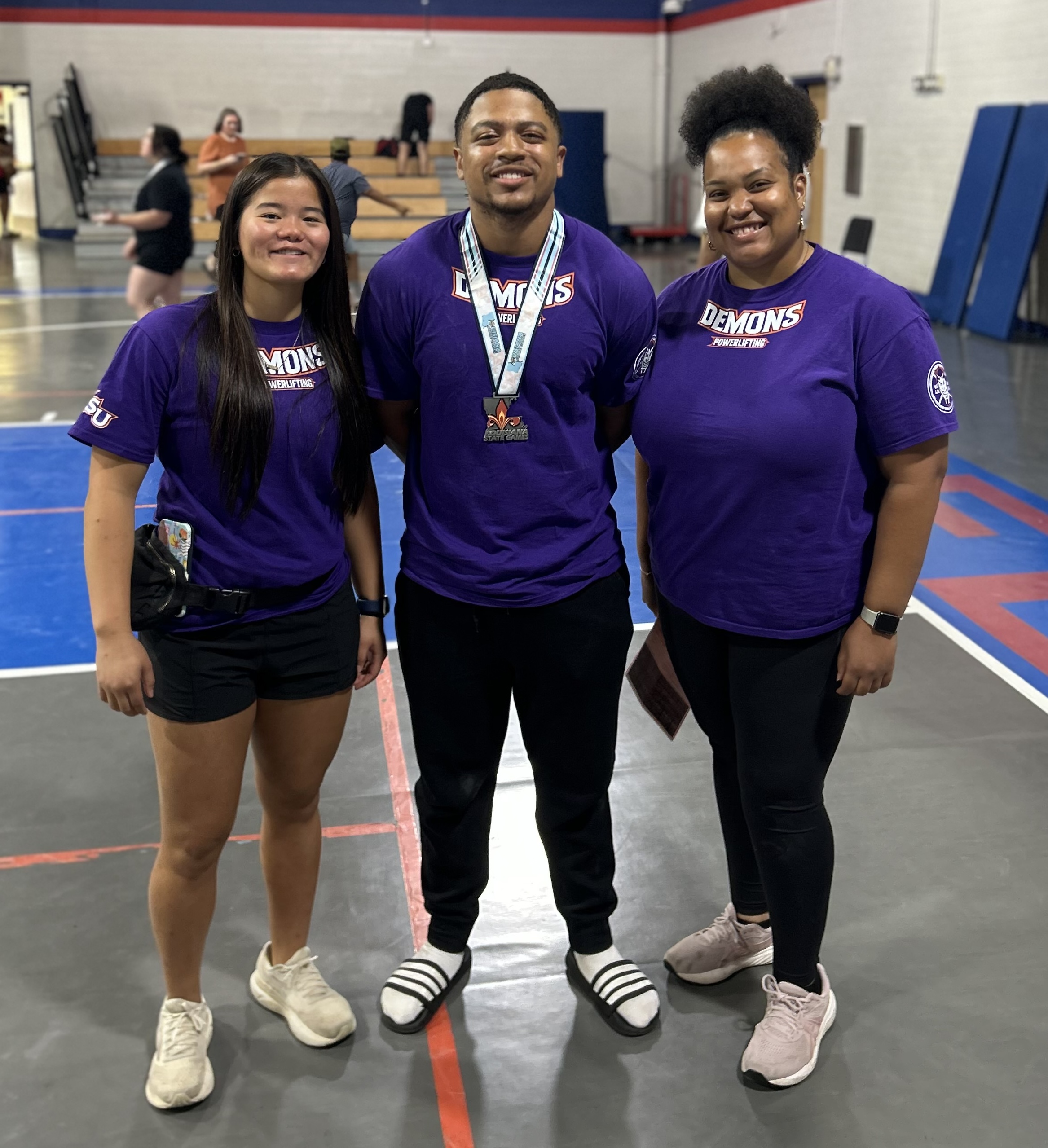 From left are Powerlifting Club President Breanne Jones of Shreveport, Seastrunk and Club Coach Maya Lucas.
