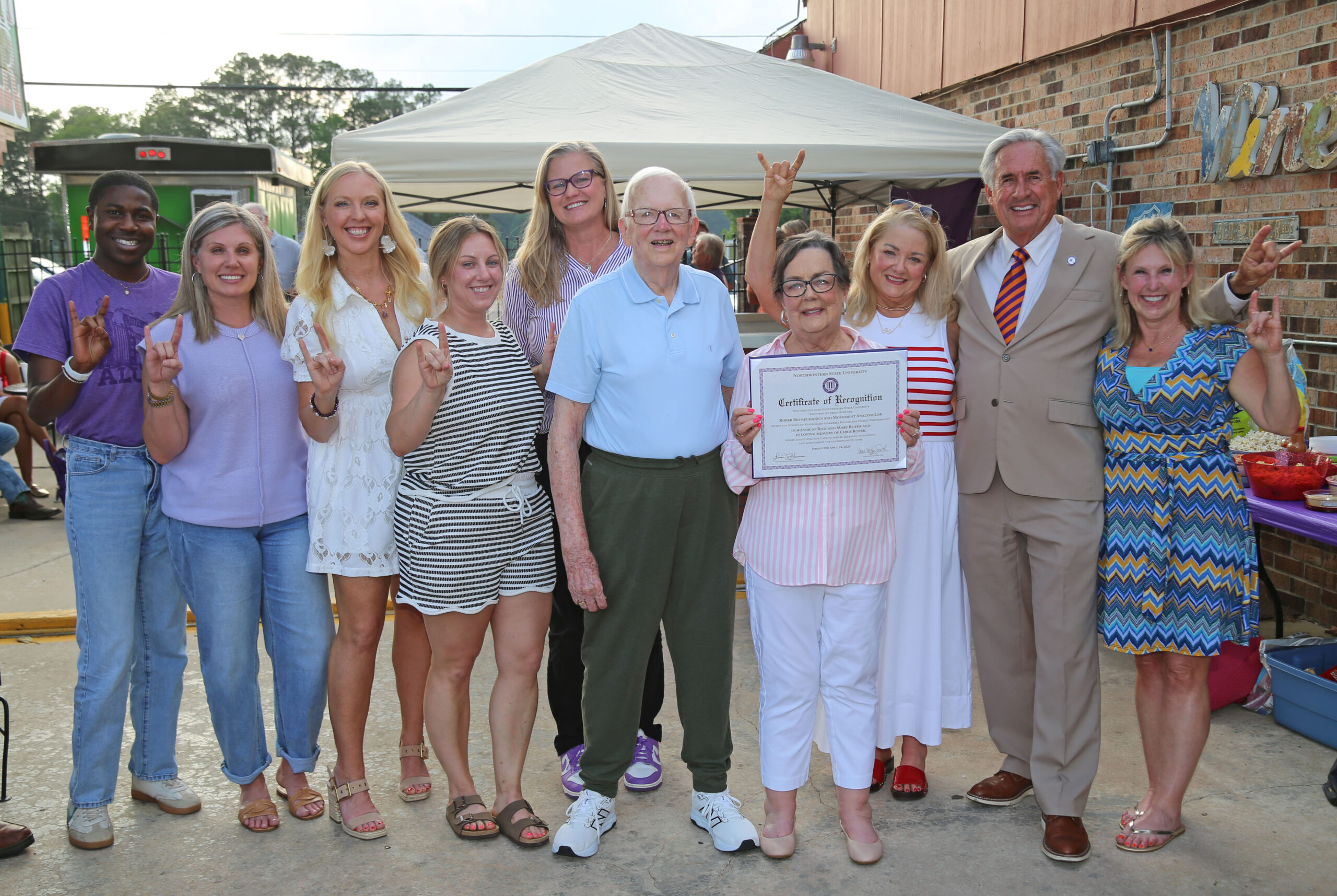 NSU’s School of Kinesiology announced the naming of The Roper Biomechanics and Movement Analysis Lab April 24. From left are Terry Wilson and Cristy Bernard with Alumni Affairs, School of Kinesiology faculty Dr. Haley Blount, Dr. Lauren Mitchell and Dr. Tara Tietjen-Smith, director; Rick and Mary Roper, Cindy Loudenslager, NSU President James Genovese and Jill Bankston, Alumni Affairs.