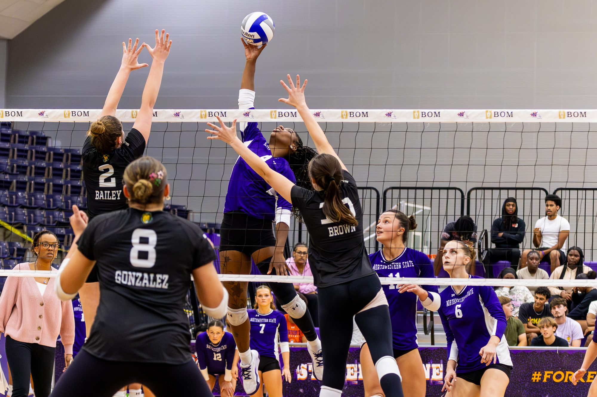 Northwestern State’s Kenadii Winfrey attacks at the net during the Demons’ Fork Cancer match against Southeastern Louisiana Thursday, Oct. 1, at Prather Coliseum.